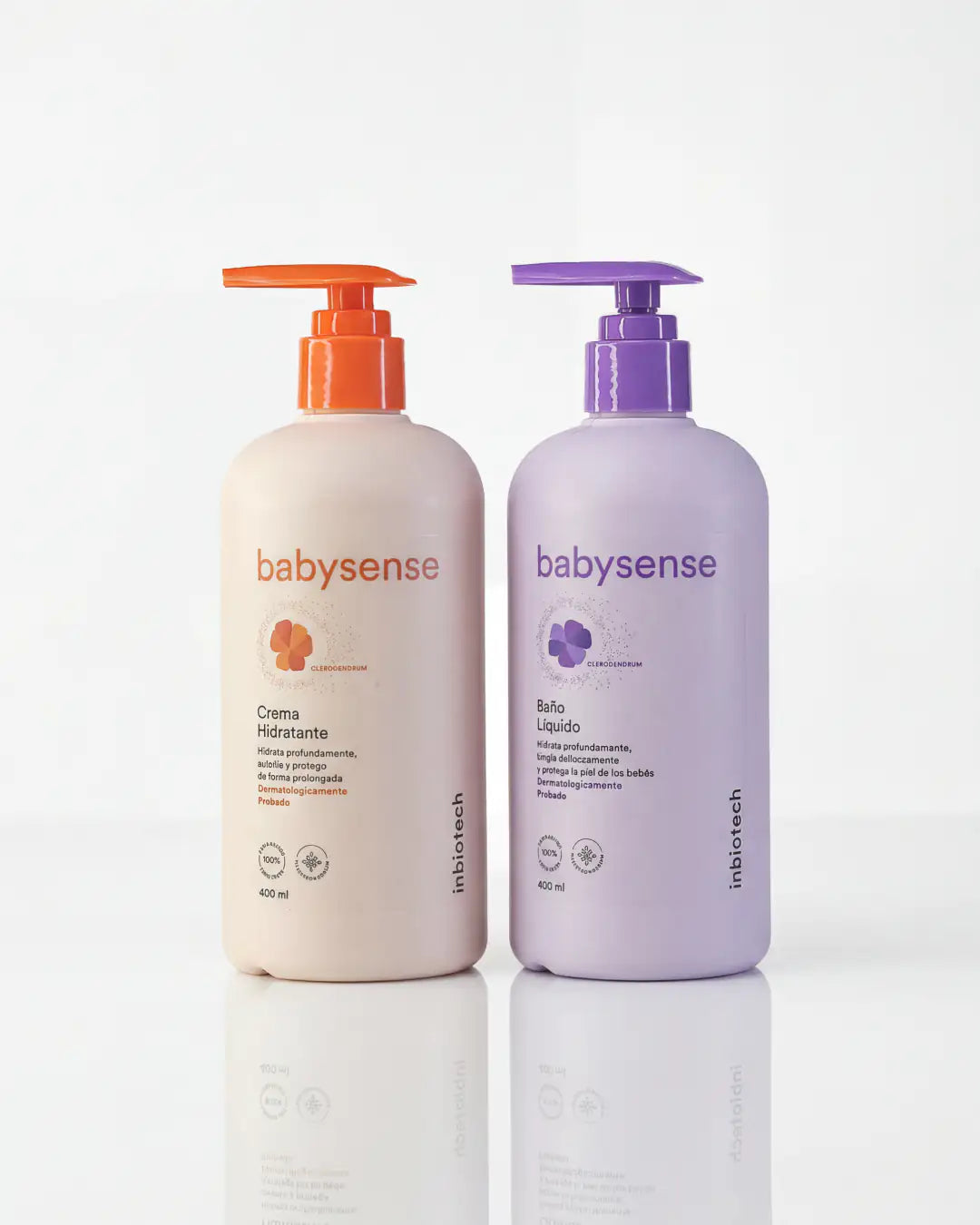 Dos botellas Babysense con dispensador tipo bomba, una de crema hidratante en tono beige y otra de baño líquido en tono morado sobre fondo blanco
